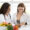Women's personalized nutrition research consultation with doctor discussing gut health and microbiome science