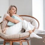 Woman experiencing IBS vs SIBO symptoms bloating discomfort